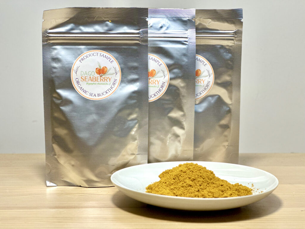Organic sea buckthorn powder from Estonia in sample packs and on a plate