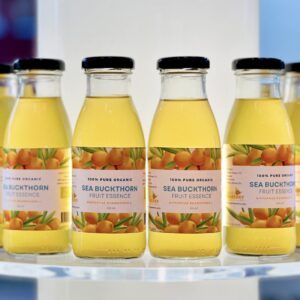 Organic sea buckthorn fruit essence from Estonia – 250ml glass bottles on display